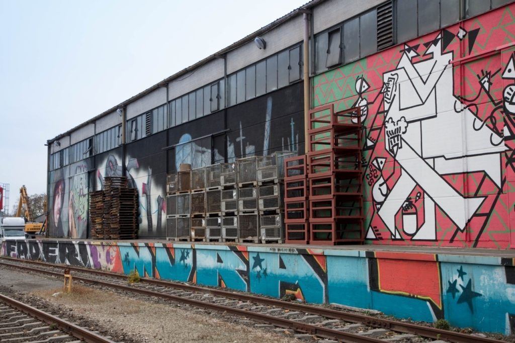 Linz street art at railway loading dock.