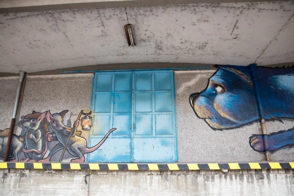 Cat and mice mural on loading dock wall in Linz harbor.