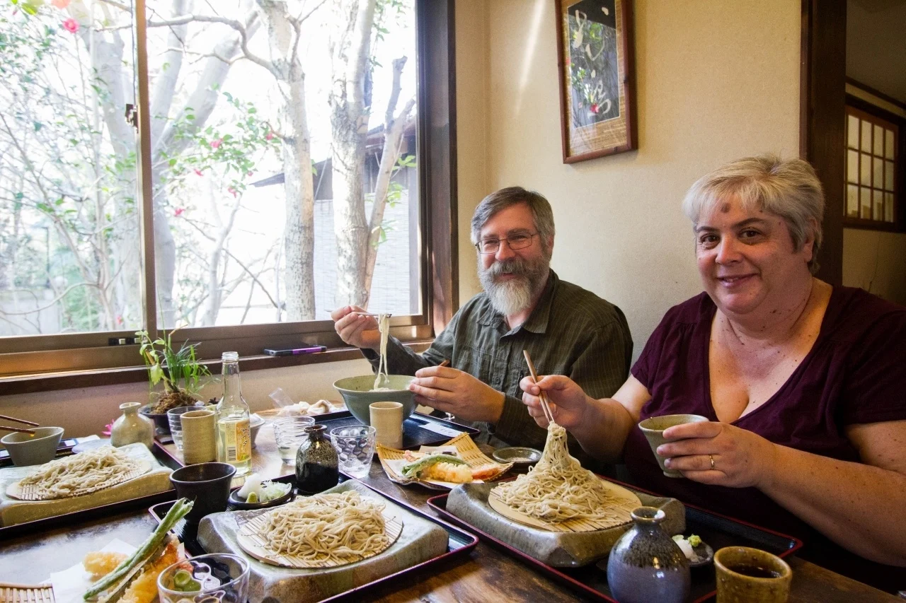 Jim and Corinne try foods all over the world. Here they are eating soba in Nara, Japan.
