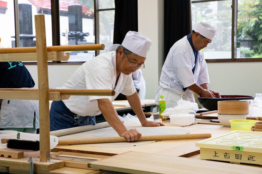 Chefs using centuries old techniques to make traditional Japanese soba noodles.