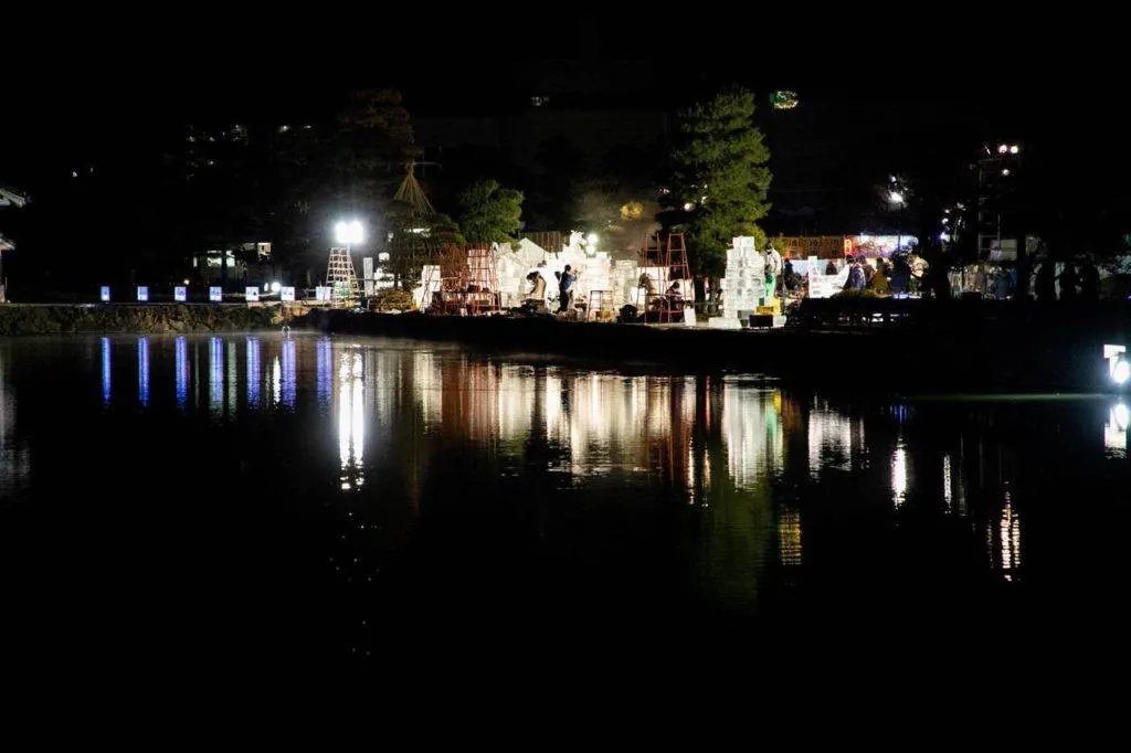 A nighttime view of all the Japanese ice sculptures in the Matsumoto Castle park.