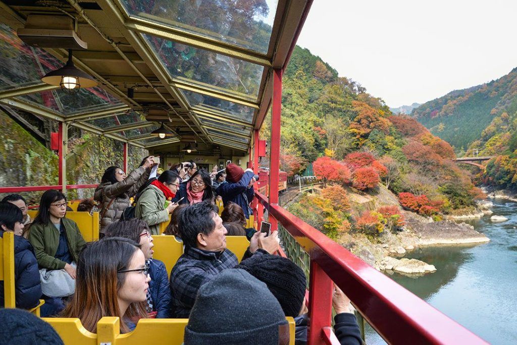 Autumn in Japan includes viewing the foliage, like from the Sagano Train.