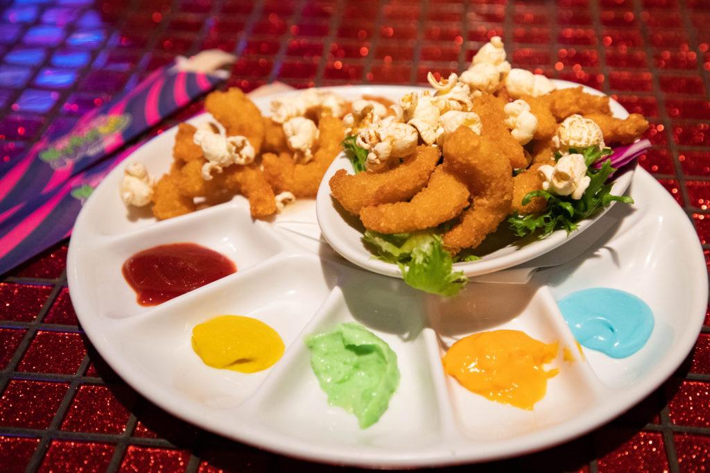 Fried shrimps and popcorn with many colors of sauces, lunch at the Kawaii Monster Café.