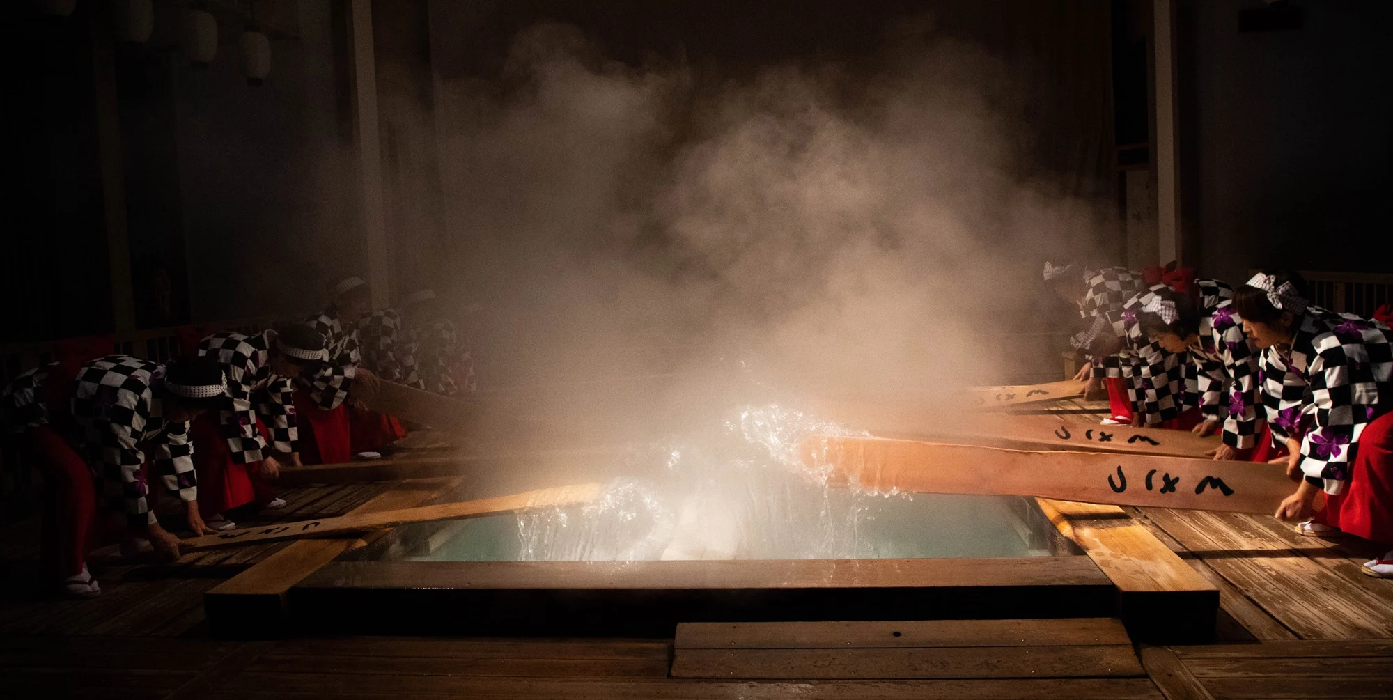 Turning off the lights allows the viewer to see the water and steam during the Yumomi ritual.