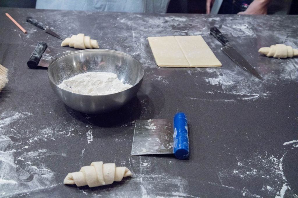 Rolling our croissants is one of our first steps at the baking class in Paris.