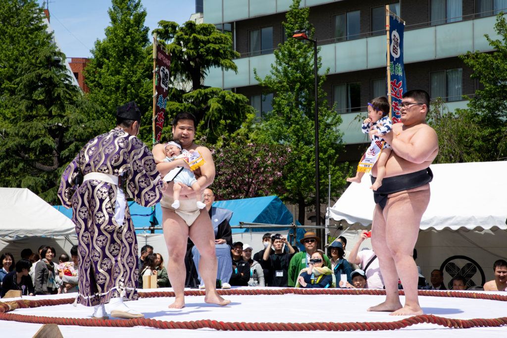 Both babies crying but which one is louder at the Sumo baby crying festival.