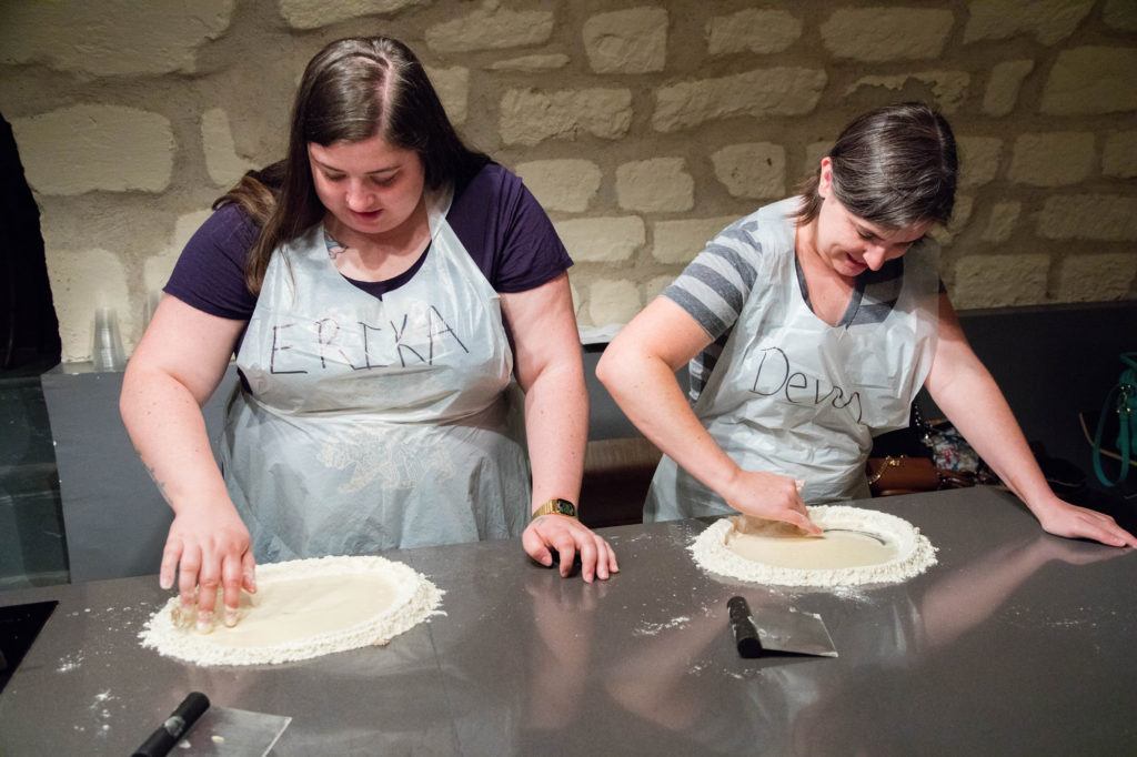 My daughters learning to make dough, without a bowl in Paris.