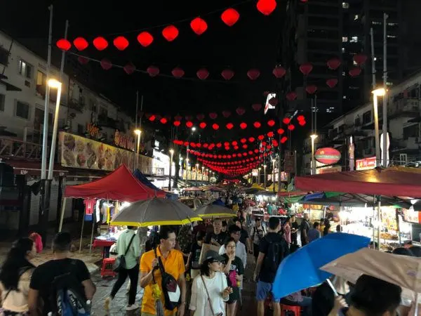 Jalon Alor, the famous night food street, even in the rain.
