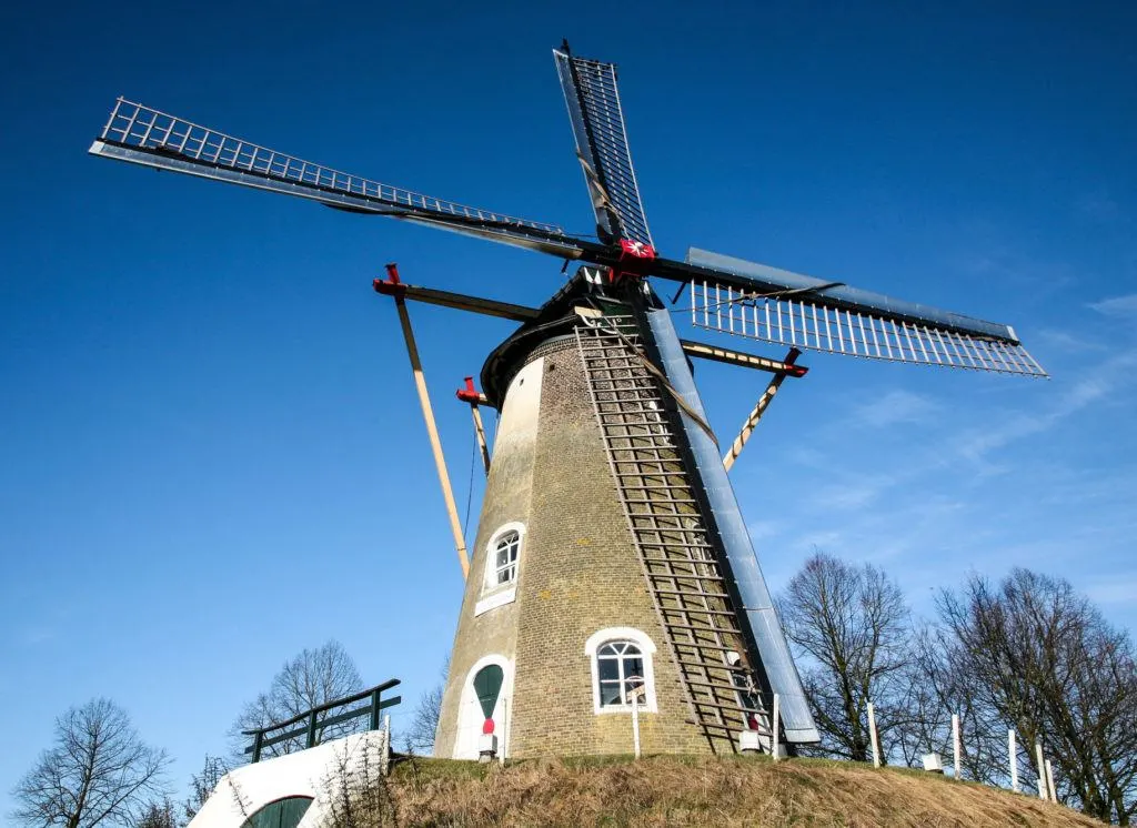 A windmill standing on a hill is truly the symbol of the Netherlands.