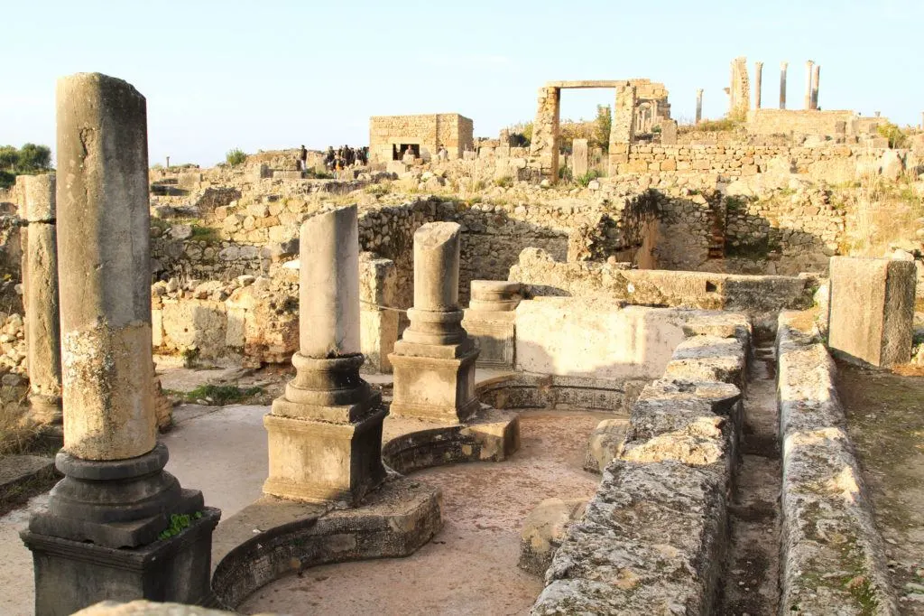When visiting Volubilis, walk among the ruins to see Roman architecture up close.