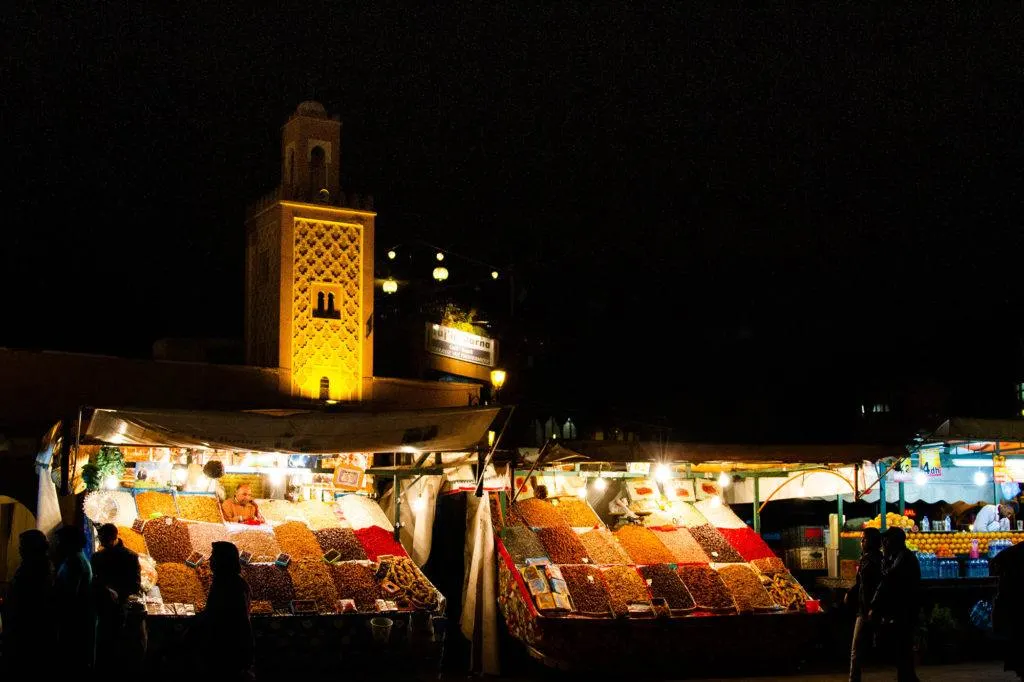 Spices and Minaret lit up in the Marrakech Medina.
