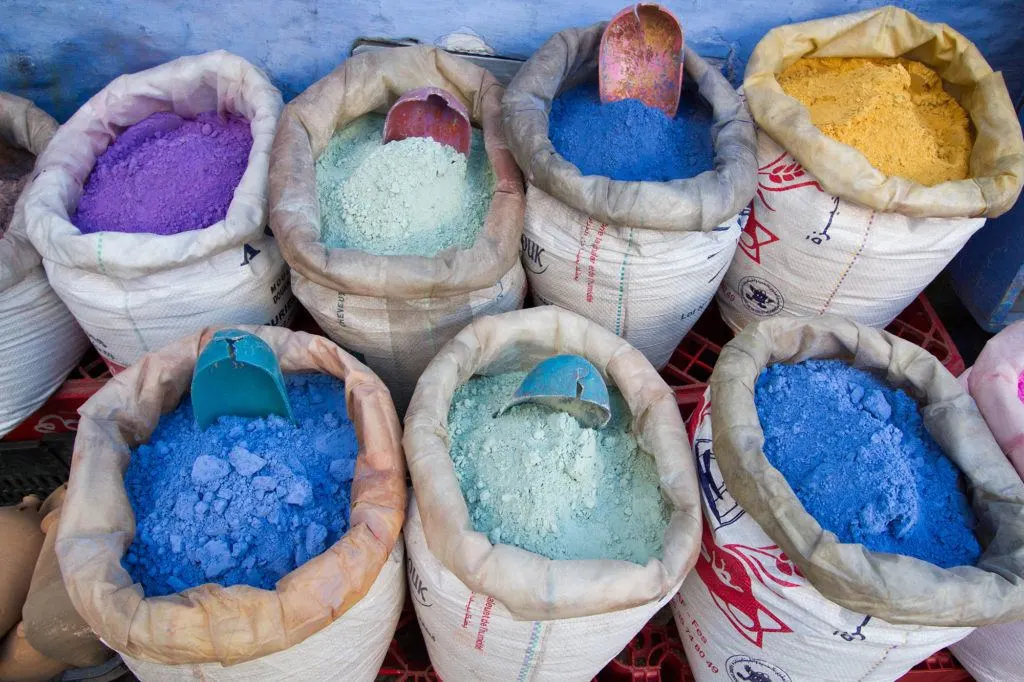 Outside a shop, these bags of dyes show how popular blue is.