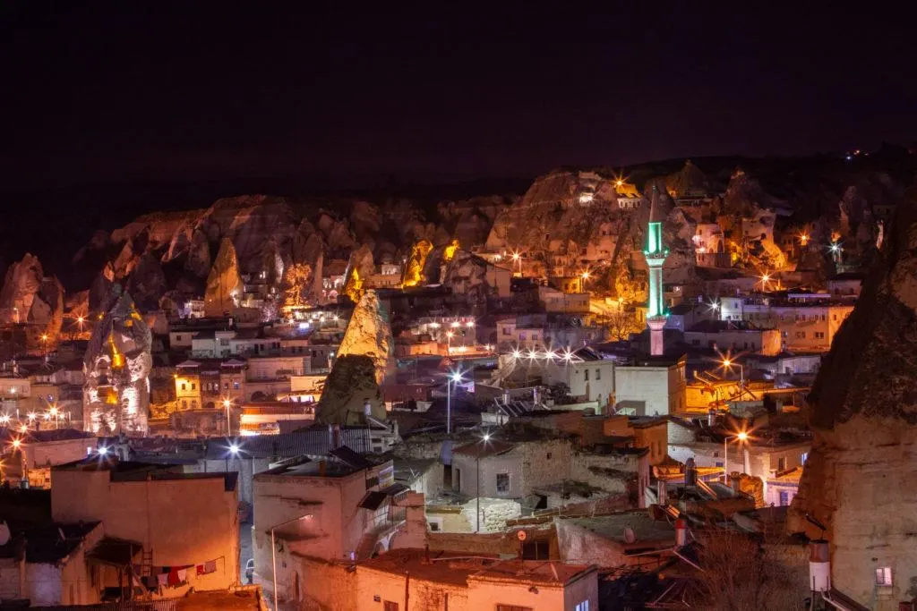 Goreme is the largest city in Cappadocia and it shines at night with the minaret and rock formations illuminated.