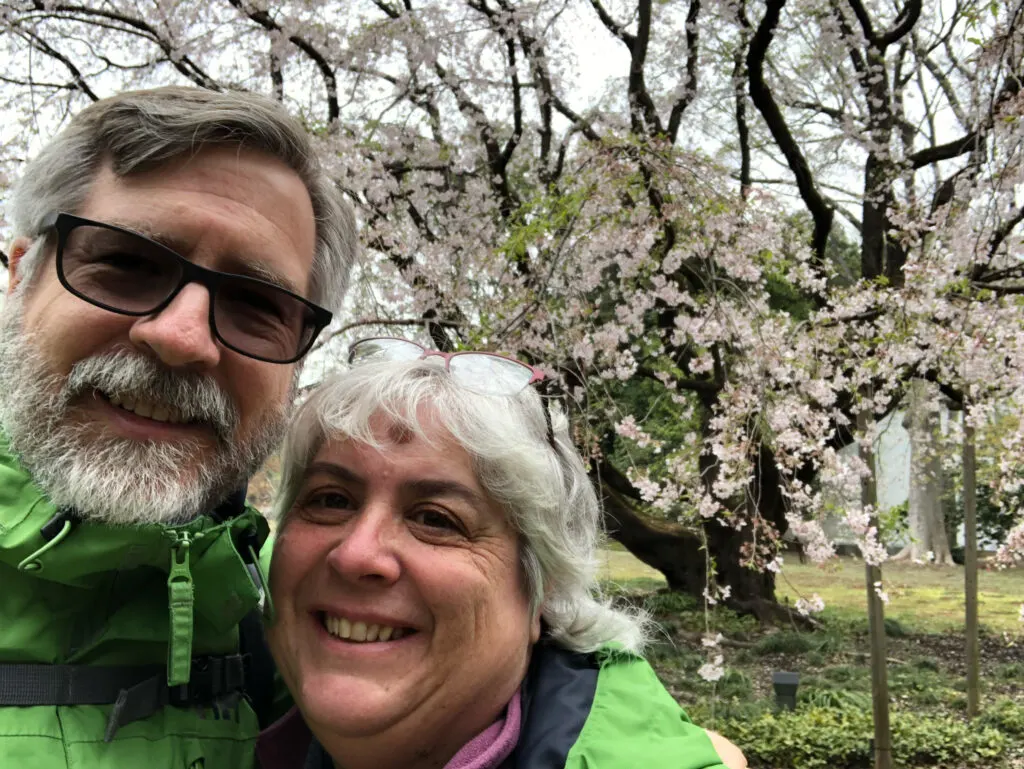 Jim and Corinne under a cherry blossom tree, Japan.