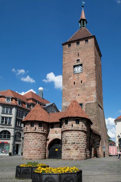 The clock tower in Nuremberg Old Town is perfectly restored and an example of medieval architecture.