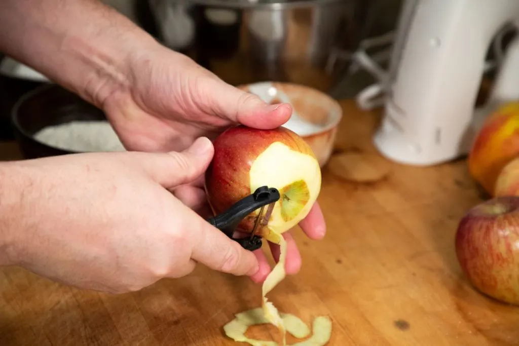 Peeling the apple for our Lithuanian apple cake recipe.