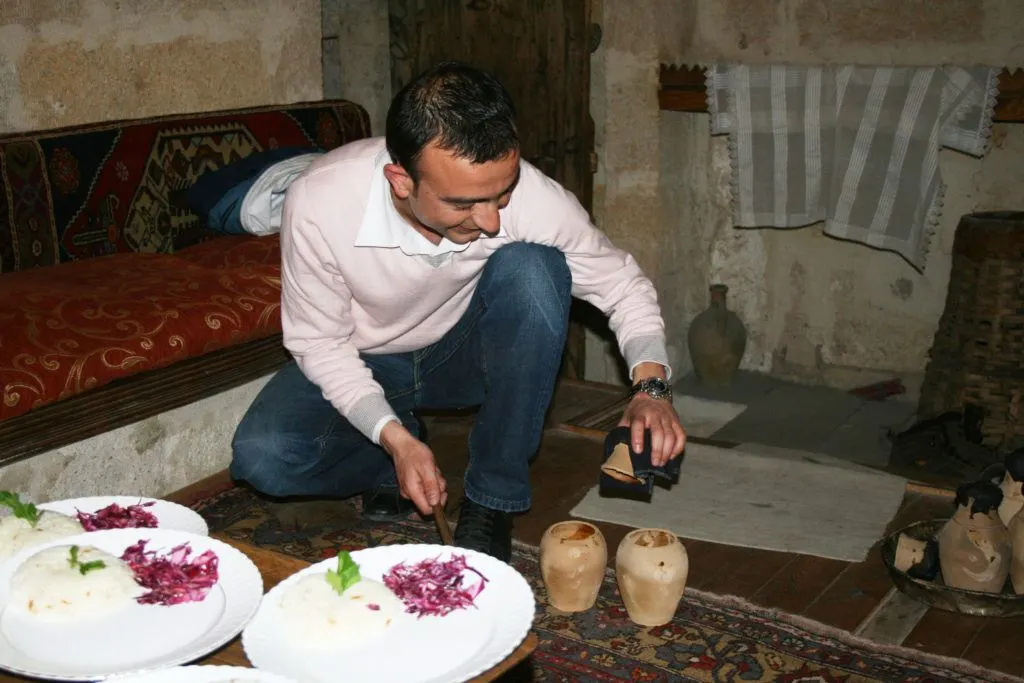Mehmet serving us our testi kebab, a must-eat in Cappadocia.