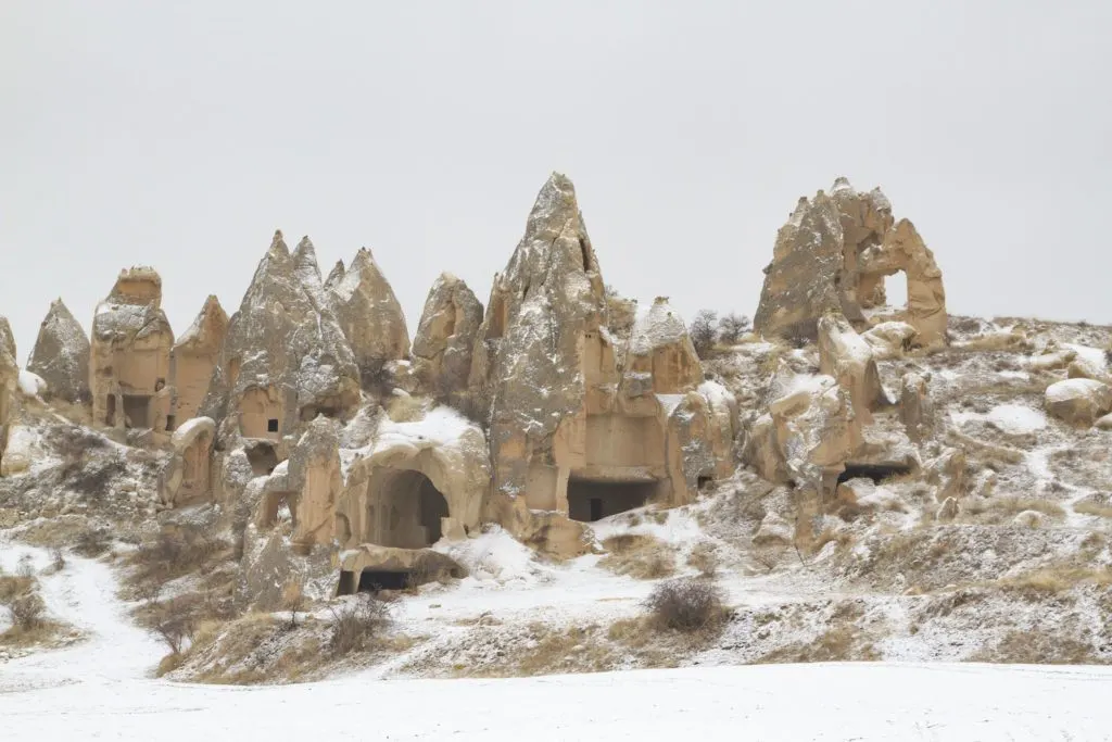 Snow blankets the fairy chimneys in Cappadocia.
