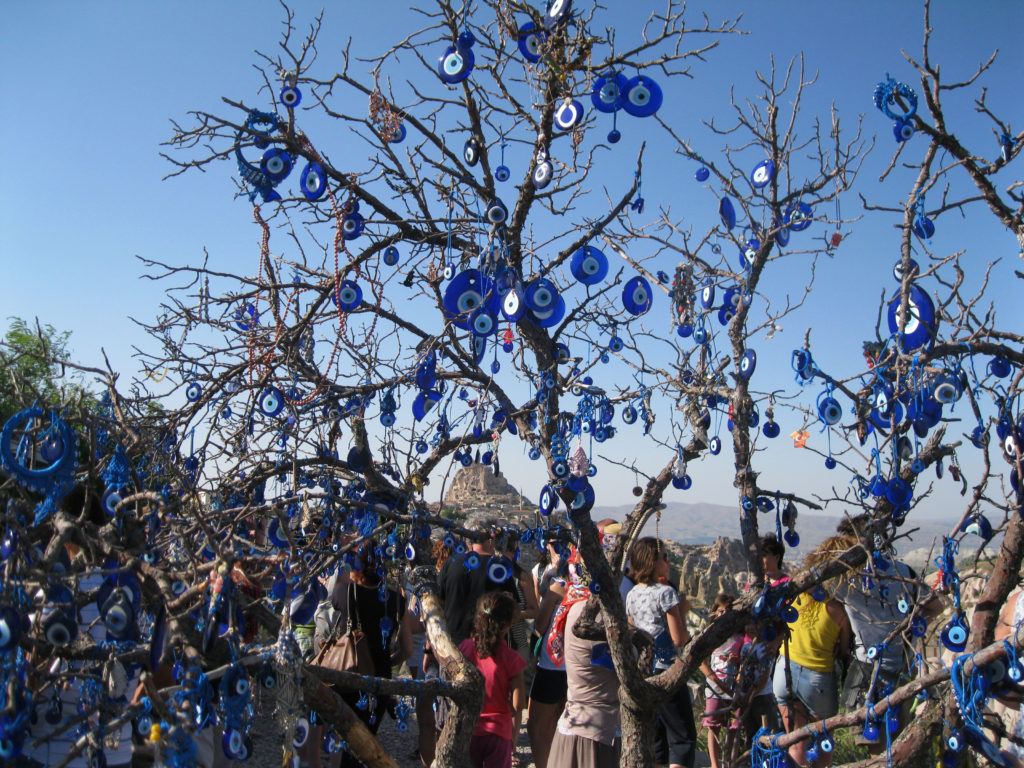 A tree in Cappadocia, decorated with Turkish evil eye glass beads.