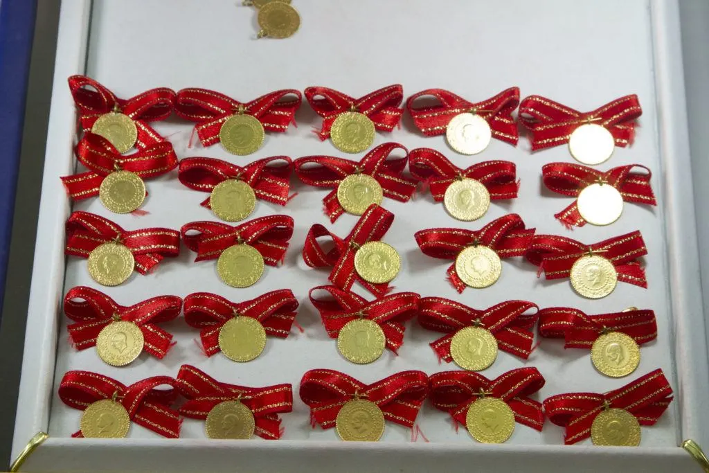 Gold coins attached to red ribbon bows are Turkish good luck objects and make great gifts from Turkey.