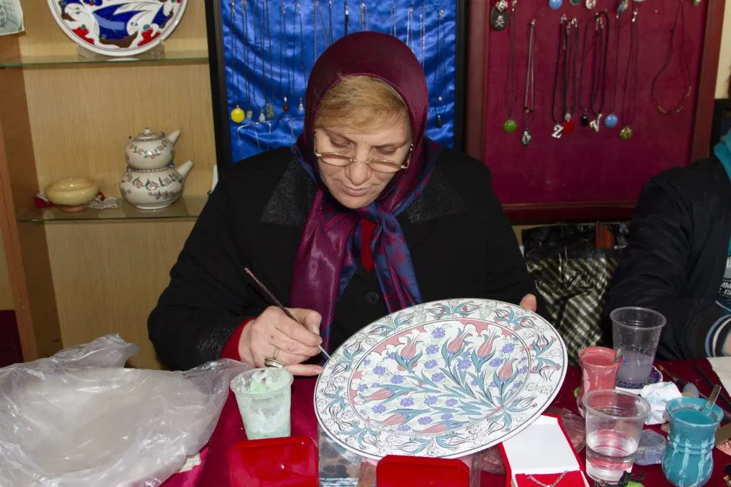 Women painting Iznik ceramics in Turkey.
