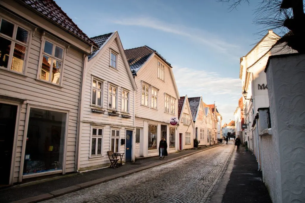 Street in Bergen with traditional white houses and dusting of snow. It’s cold in Bergen in January, but it’s also beautiful.
