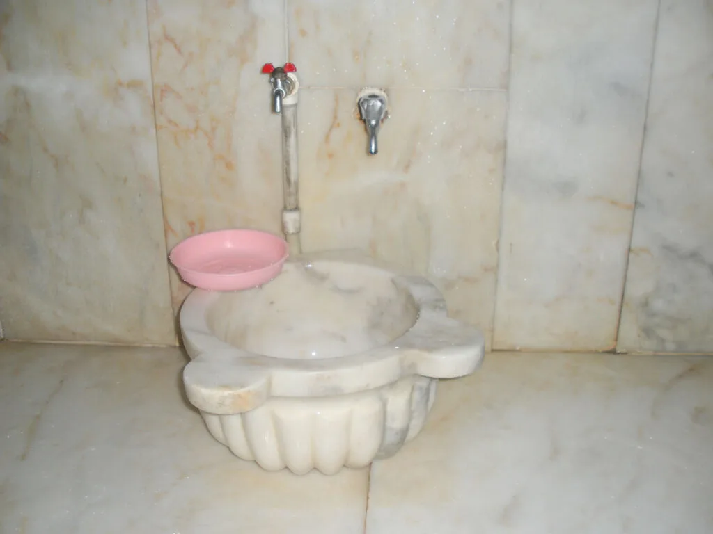 Interior of hamam washing room and its alabaster sink.