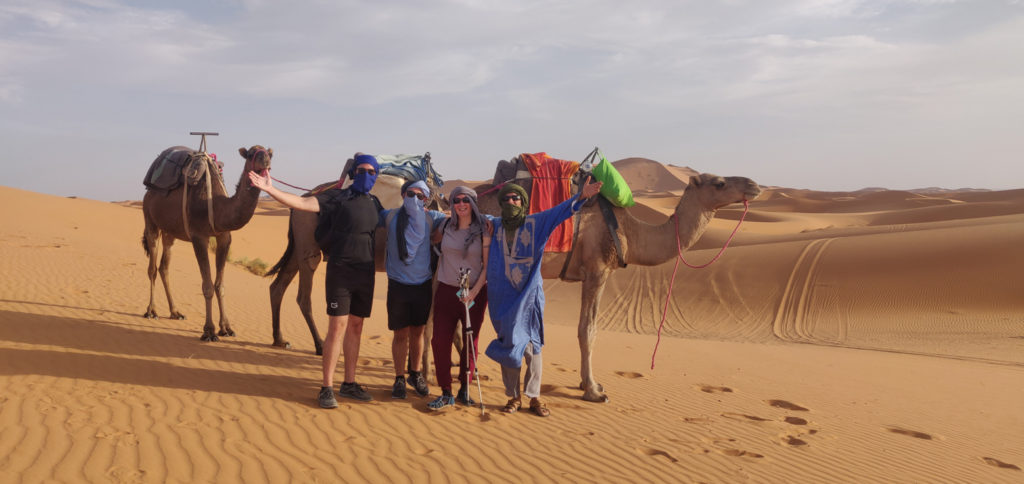 Sahara hiking group with camels.