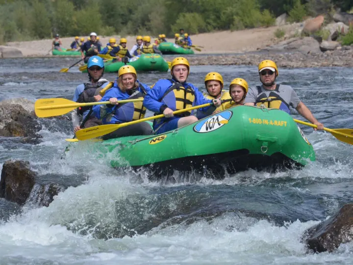 Traveling kids like to do adventure tours, and here they are rafting.