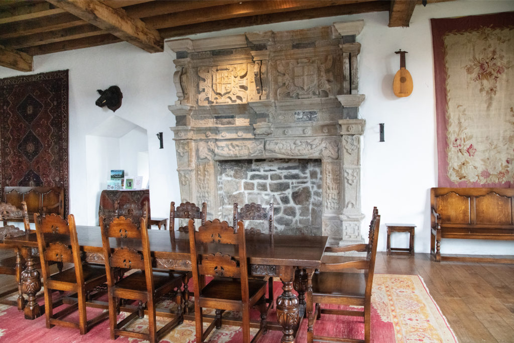 Fireplace and dining table in the Great Hall in Donegal Castle.