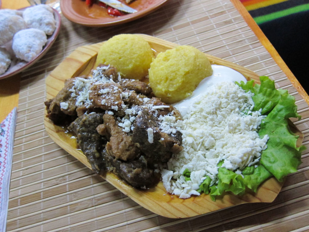 A typical meal in Moldova - pork, mamaliga or polenta, and cheese.