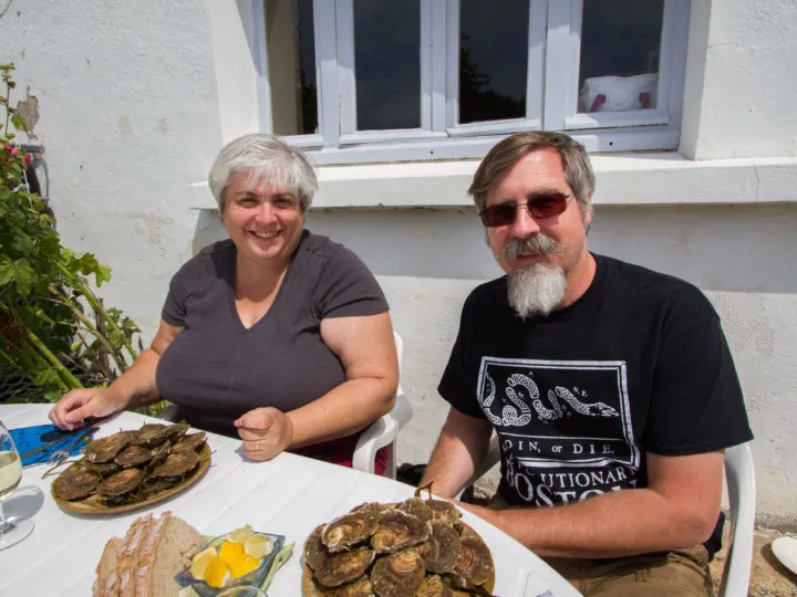 Enjoying the sun and a plateful of fresh oysters.