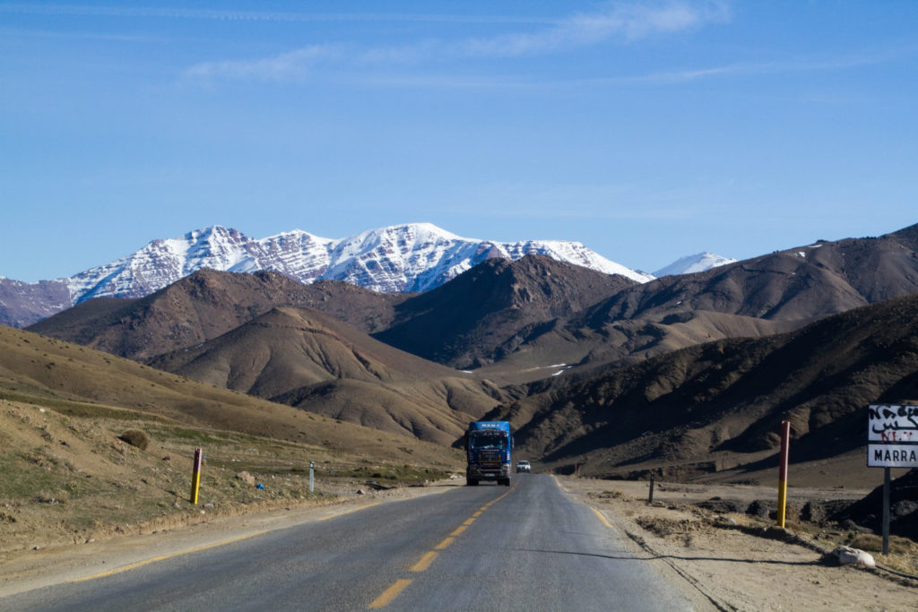 A windshield view of the road to Marrakech through the High Atlas Mountains.
