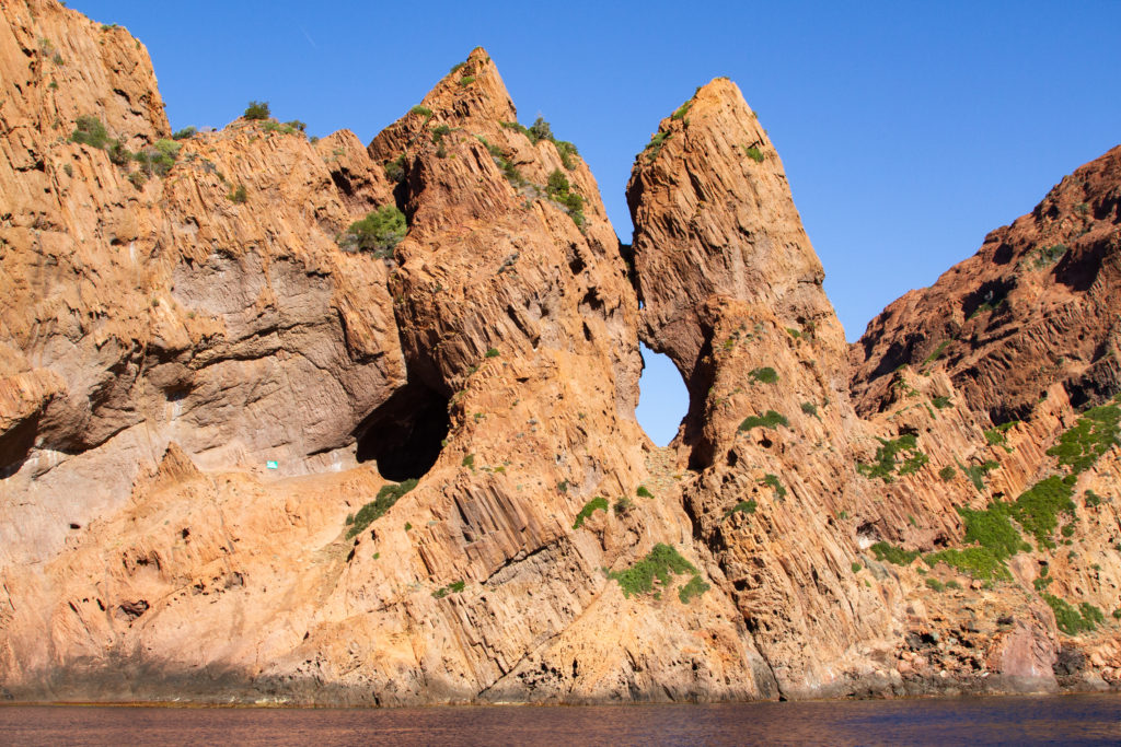 Stunning holes peek through the cliffs in the Scandola Nature Reserve.