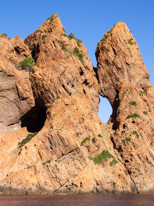 Stunning holes peek through the cliffs in the Scandola Nature Reserve.