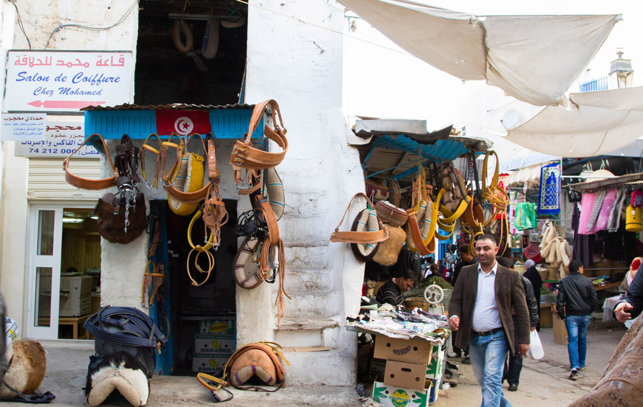 Traveling to Tunisia, this scene of a local souk with handmade animal harnesses is commonplace.