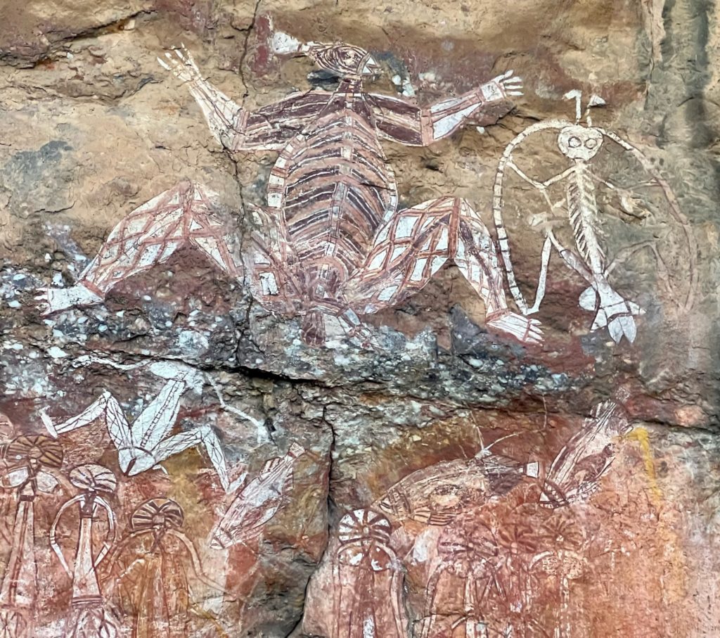 Australian Aboriginal rock art in the sheltered outcrop at Anbangbang. The painting features Lightning Man and his family.