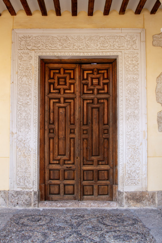 An ornate door and frame; the University of Alcala de Henares.