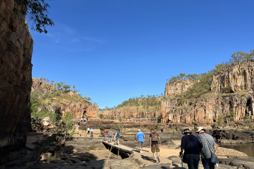 Visitors to Nitmiluk Gorge walk from gorge 1 to gorge 2 where they will take a second boat.