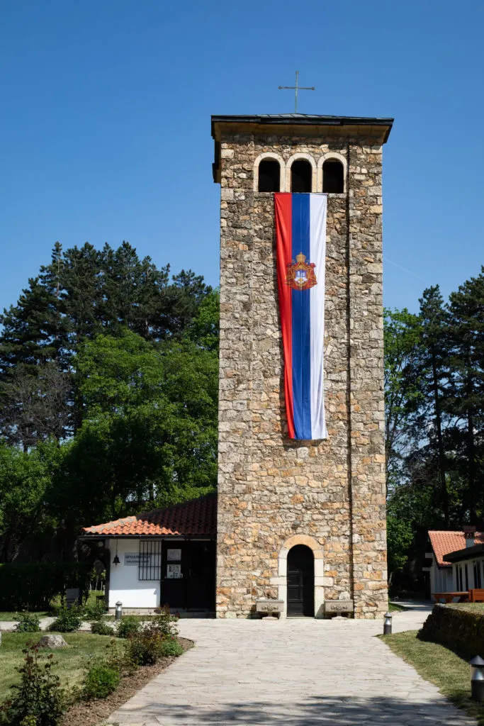 Tower and Kosovo flag, Peja, Kosovo.