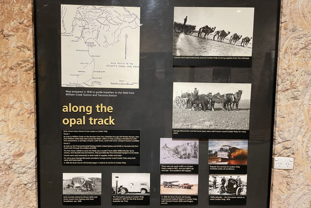 A display in the Umoona Opal Mine and Museum in Coober Pedy with historical photos of scenes along the opal track.
