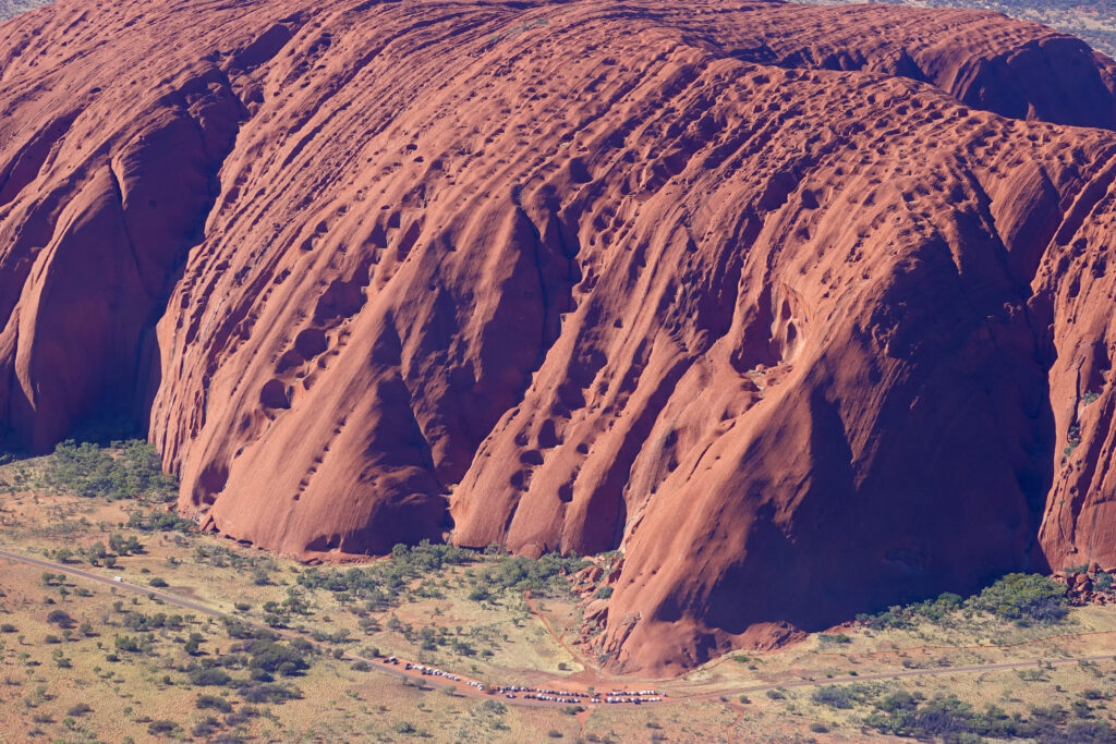Closeup of Uluru showing the pits and ridges created by wind and water.