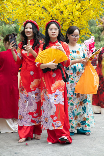Vietnames women dressed in traditional ao dai.