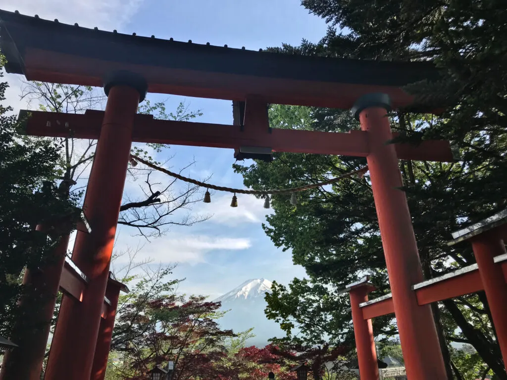Arakura Sengen Shrine torii with a view of Mt. Fuji in the middle.