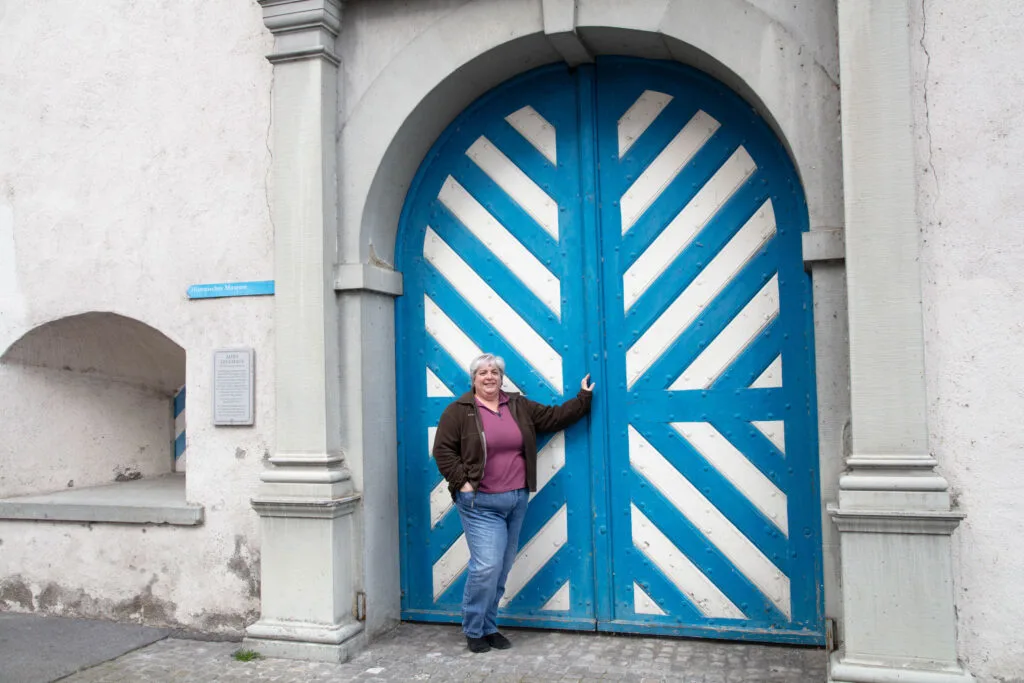 Great architectural details are everywhere in Lucerne. Corinne in front of blue and white door.