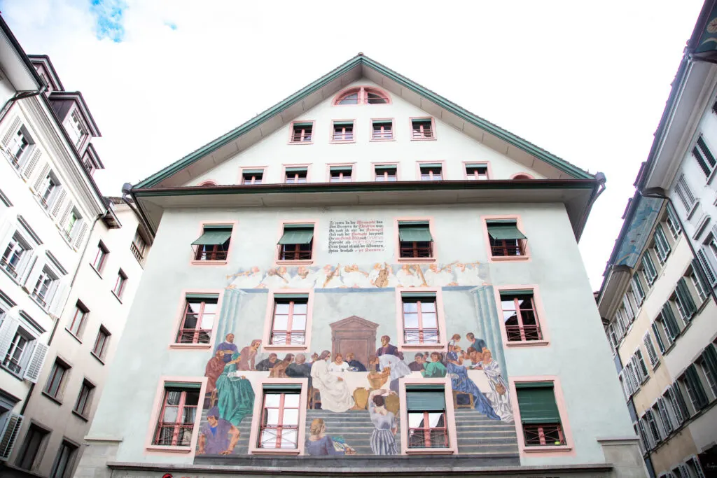 A colorful mural depicting Easter dinner painted by Von Eduard Renggli on the Weinmarkt in Lucerne.