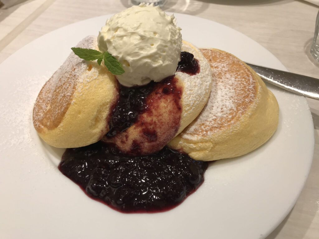 Getting kids to eat while they are on a trip can be difficult. Let them order fluffy pancakes for dinner.