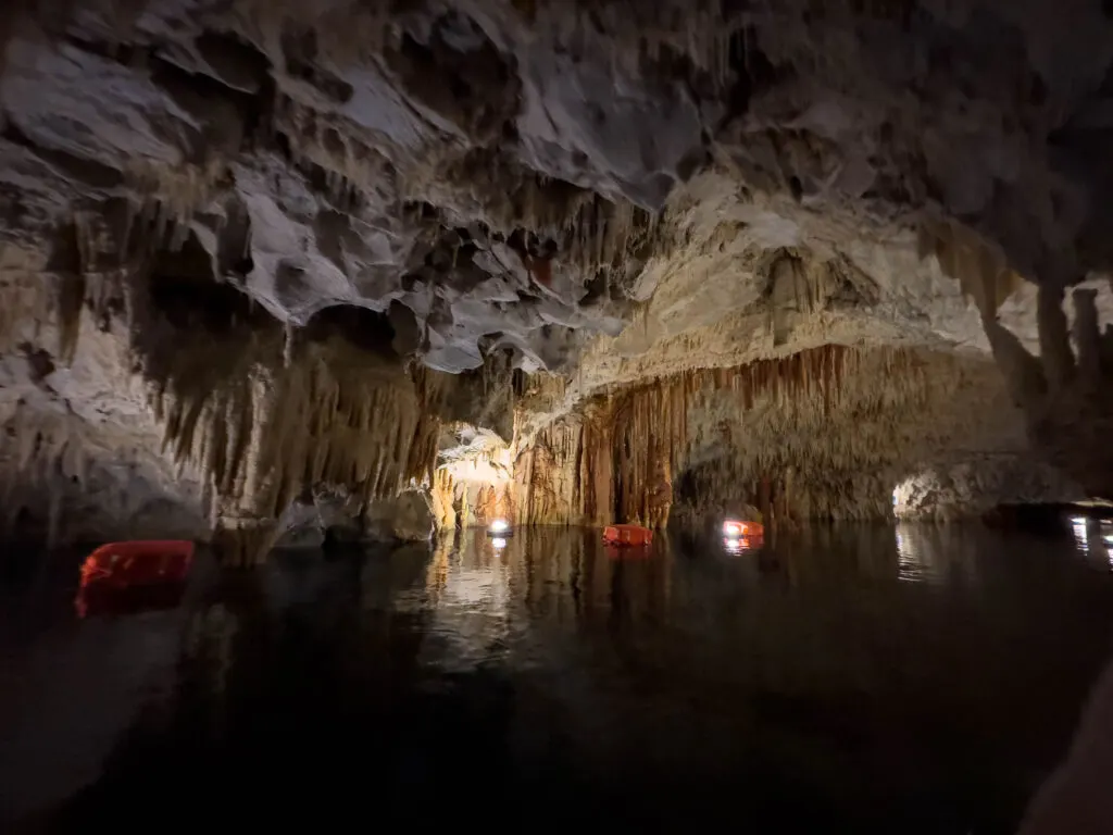 The Diros Caves in Greece provide a spectacular glance at limestone stalagmites and stalatites like these.