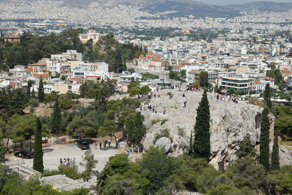 Northwest view from the Acropolis overlooking Athens and the rock outcropping called Mars Hill or Areopagus.