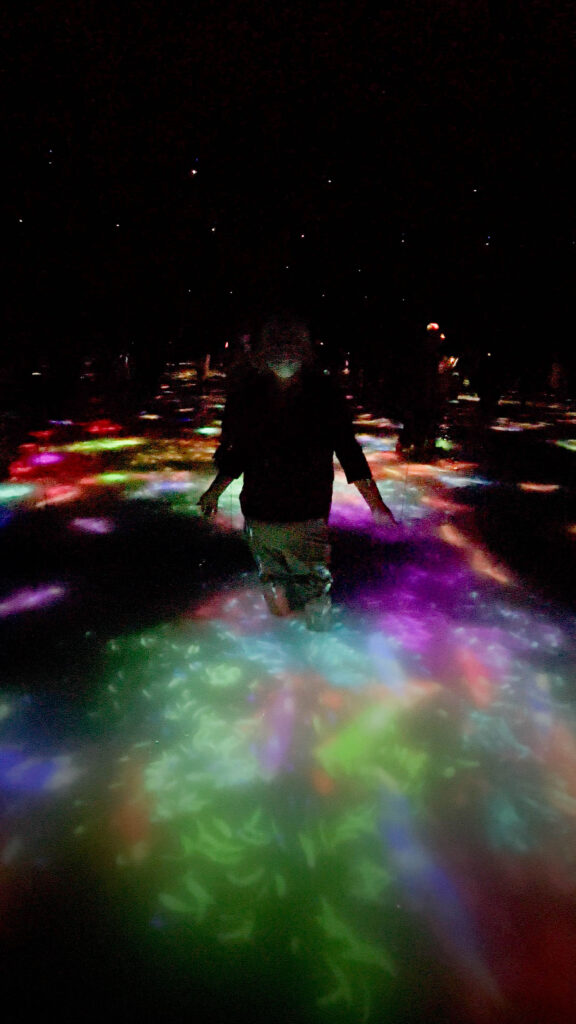 Corinne playing in the water at TeamLab Planets.